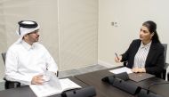 Dr. Faisal Misfer Al Hababi (left) with a QU official.