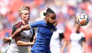 Christopher Nkunku of Chelsea is challenged by Luc De Fougerolles of Fulham during the Premier League Summer Series match between Chelsea FC and Fulham FC at FedExField on July 30, 2023 in Landover, Maryland. Tim Nwachukwu/Getty Images/AFP