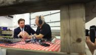 Republican presidential candidate Florida Governor Ron DeSantis gives a radio interview at Ashley's BBQ Bash hosted by Congresswoman Ashley Hinson (R-IA) on August 06, 2023 in Cedar Rapids, Iowa. (Photo by SCOTT OLSON / GETTY IMAGES NORTH AMERICA / Getty Images via AFP)
