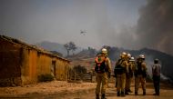 Personnel of the Protection and Relief Intervention Group (GIPS) specialised in combating forest fires, arrive to battle a wildfire in Reguengo, Portalegre district, south of Portugal, on August 8, 2023. Photo by Patricia DE MELO MOREIRA / AFP