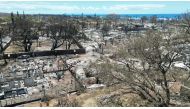 This aerial photo shows destroyed buildings and homes in the aftermath of a wildfire in Lahaina, western Maui, Hawaii on August 11, 2023. (Photo by Sébastien Vuagnat / AFP)