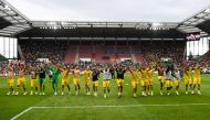 Dortmund's players celebrate after the German Cup 1st round football match between TSV Schott Mainz and Borussia Dortmund in Mainz, western Germany on August 12, 2023. (Photo by Kirill KUDRYAVTSEV / AFP)