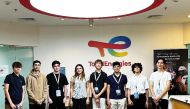 Students pose for a group photo at the conclusion of an internship program.