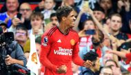 Manchester United's French defender #19 Raphael Varane celebrates scoring the opening goal during the English Premier League football match between Manchester United and Wolverhampton Wanderers at Old Trafford in Manchester, north west England, on August 14, 2023. (Photo by Lindsey Parnaby / AFP) 