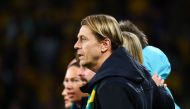 Australia's coach Tony Gustavsson stands for Australia's national anthem before the start of the Australia and New Zealand 2023 Women's World Cup third place play-off football match between Sweden and Australia at Brisbane Stadium in Brisbane on August 19, 2023. Photo by Patrick Hamilton / AFP