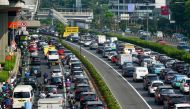 Traffic is seen during morning rush hour in Jakarta on August 21, 2023, the first day the local government began a remote working scheme for 50 percent of its employees to help reduce air pollution. Photo by BAY ISMOYO / AFP