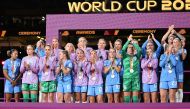England's players stand on the podium after receiving the runners up medals at the end of the Australia and New Zealand 2023 Women's World Cup final football match between Spain and England at Stadium Australia in Sydney on August 20, 2023. Photo by WILLIAM WEST / AFP