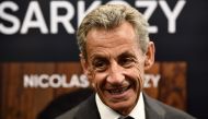 Former French President Nicolas Sarkozy reacts during a book signing session for his last book, in Arcachon, southwestern France, on August 25, 2023. (Photo by Christophe ARCHAMBAULT / AFP)
