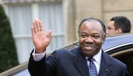 (Files) Gabonese President Ali Bongo Ondimba waves as he leaves the Elysee Palace after a meeting with French President Nicolas Sarkozy at the Elysee Palace in Paris, on February 21, 2011. (Photo by Eric Feferberg / AFP)
 