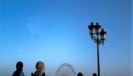 Women wearing an abaya walk on a bridge in the southwestern city of Toulouse, France. (Photo by Charly Triballeau / AFP)
