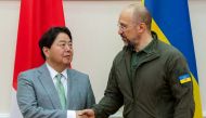 This photograph taken and released by Cabinet of Ministers of Ukraine on September 9, 2023, shows Ukraine's Prime Minister Denys Shmyhal (R) shaking hands with Japan's Foreign Minister Yoshimasa Hayashi (L) during their meeting in Kyiv. (Photo by Handout / Cabinet of Ministers of Ukraine / AFP) 