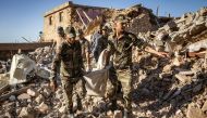 Moroccan Royal Armed Forces evacuate a body from a house destroyed in an earthquake in the mountain village of Tafeghaghte, southwest of the city of Marrakesh, on September 9, 2023. Photo by FADEL SENNA / AFP)
