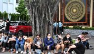Relatives wait outside a funeral house during the identification of victims of the major fire at an apartment block in Hanoi on September 13, 2023. (Photo by AFP)
