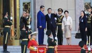 In this handout picture released by the Miraflores press office, Chinese President Xi Jinping (C-R), his wife Peng Liyuan (R), welcome Venezuelan President Nicolas Maduro (2-L) and his wife Cilia Flores (L) upon arrival at the Great Hall of the People in Beijing on September 13, 2023. (Photo by Jhonn Zerpa / Venezuelan Presidency / AFP) /