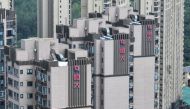 (FILES) The Evergrande logo is seen on residential buildings in Nanjing, in China痴 eastern Jiangsu province on August 18, 2023. (Photo by STRINGER / AFP) / China OUT
