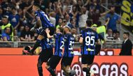 Inter Milan's French forward #09 Marcus Thuram (Bottom L) celebrates with teammates after scoring his team's second goal during the Italian Serie A football match between Inter Milan and AC Milan at the San Siro Stadium in Milan on September 16, 2023. (Photo by GABRIEL BOUYS / AFP)
