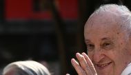 Pope Francis waves as rides in his popemobile past pilgrims and onlookers as he makes his way to celebrate mass at the Velodrome stadium, in the southern port city of Marseille on September 23, 2023. 
