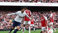 Tottenham Hotspur's South Korean striker #07 Son Heung-Min (L) celebrates after scoring their first goal during the English Premier League football match between Arsenal and Tottenham Hotspur at the Emirates Stadium in London on September 24, 2023. (Photo by HENRY NICHOLLS / AFP)