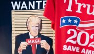 T-shirts seen for sale before a campaign rally with former US President Donald Trump on September 25, 2023 in Summerville, South Carolina. (Photo by Sean Rayford / Getty Images via AFP)