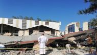 This handout picture released by the Tamaulipas Civil Protection shows a priest looking at the site where people were trapped after a church roof collapsed in Ciudad Madero, Tamaulipas State, Mexico, on October 1, 2023. Photo by Handout / Tamaulipas Civil Protection / AFP