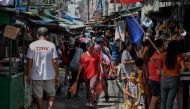 People visit a market in Manila on October 5, 2023. (Photo by JAM STA ROSA / AFP)