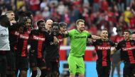 Leverkusen players celebrate after the German first division Bundesliga football match between Bayer 04 Leverkusen and FC Cologne in Leverkusen, western Germany on October 8, 2023. (Photo by INA FASSBENDER / AFP)