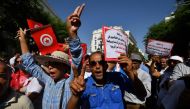 Supporters of the president of the Free Destourian Party (PDL) Abir Moussi shout slogans demanding her release during a demonstration organized in Tunis on October 15, 2023. (Photo by FETHI BELAID / AFP)

