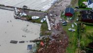 An aerial picture taken on October 21, 2023 shows the damage on the coast in Hesnaes, on the Danish island of Falster after a storm hit the area. (Photo by Ingrid Riis / Ritzau Scanpix / AFP) 