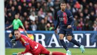 Paris Saint-Germain's French forward #07 Kylian Mbappe shoots the ball past Strasbourg's Belgian goalkeeper #01 Matz Sels during the French L1 football match between Paris Saint-Germain (PSG) and Strasbourg at the Parc des Princes stadium in Paris on October 21, 2023. (Photo by FRANCK FIFE / AFP)
