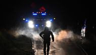Law enforcement are seen outside the home of suspect Robert Card's father and brother in Bowdoin, Maine on October 26, 2023, in the aftermath of a mass shootings in Lewiston, Maine. Photo by ANGELA WEISS / AFP