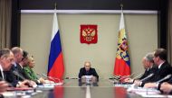 In this pool photograph distributed by Sputnik agency Russia's President Vladimir Putin (centre) chairs a meeting with members of Security Council, Russian government and law enforcement agencies in Moscow on October 30, 2023. (Photo by Gavriil Grigorov / POOL / AFP)