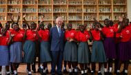Britain's King Charles III poses for a group photo with participants of the Prince's Trust International (PTI) Enterprise Challenge during a visit to the Eastlands Library in Nairobi on October 31, 2023. (Photo by Ben Stansall / POOL / AFP)
