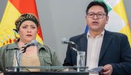 Bolivia's deputy Foreign Minister Freddy Mamani (R) speaks next to the minister of the presidency Maria Nela Prada, during the press conference on October 31, 2023. (Photo by Handout / Bolivia's Foreign Ministry / AFP) 