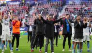 Girona's Spanish coach Michel (C) and teammates celebrate their win at the end of the Spanish league football match between CA Osasuna and Girona FC at El Sadar stadium in Pamplona on November 4, 2023. (Photo by Cesar MANSO / AFP)
