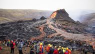 File photo for representational purposes only. People gather at the volcanic site on the Reykjanes Peninsula following Friday's eruption in Iceland, March 21, 2021. REUTERS/Cat Gundry-Beck

