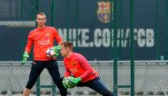 Barcelona's goalkeepers Jasper Cillessen (L) from Netherlands and Marc-Andre ter Stegen from Germany take part in a training session at the Sports Center FC Barcelona Joan Gamper in Sant Joan Despi, near Barcelona on April 1, 2017.  (AFP / PAU BARRENA)
