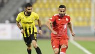 Al Shamal's Omid Ebrahimi (right) shoots at the goal.