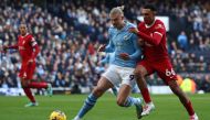 Liverpool's English defender #66 Trent Alexander-Arnold (R) vies with Manchester City's Norwegian striker #09 Erling Haaland during the English Premier League football match between Manchester City and Liverpool at the Etihad Stadium in Manchester, north west England, on November 25, 2023. (Photo by Darren Staples / AFP)