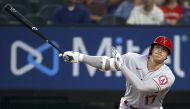 Shohei Ohtani #17 of the Los Angeles Angels bats against Dane Dunning #33 of the Texas Rangers in the top of the first inning at Globe Life Field on April 28, 2021 in Arlington, Texas. Photo by TOM PENNINGTON / GETTY IMAGES NORTH AMERICA / AFP