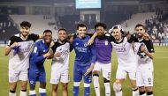 Al Sadd players celebrate after winning Qatar Clasico. 