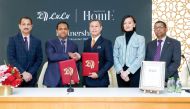 Director of LuLu Group International Dr Mohamed Althaf, Chairman of Gallery Five Group Pegasus Wong pose for group photo with other officials.