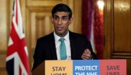 A handout image released by 10 Downing Street, shows Britain's Chancellor of the Exchequer Rishi Sunak speaking during a remote press conference to update the nation on the Covid-19 pandemic, inside 10 Downing Street in central London on March 26, 2020. Photo by Pippa FOWLES / 10 Downing Street / AFP