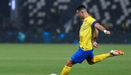 Nassr's Portuguese forward #07 Cristiano Ronaldo shoots the ball during the King Cup quarter-final football match between Al-Shabab and Al-Nassr at the Al-Shabab Club Stadium in Riyadh on December 11, 2023. (Photo by AFP)