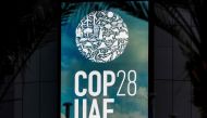 The logo of the United Nations Climate Change Conference COP28 is pictured at Expo City in Dubai on December 12, 2023. Photo by Giuseppe CACACE / AFP