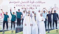 Minister of Sports and Youth H E Salah bin Ghanem Al Ali and other officials with the winners.