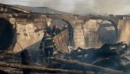 This handout photo taken and made available by the Inspectorate of Emergency Situations Prahova (ISU Prahova) on December 26, 2023 shows firemen working to extinguish a fire at the site of teh 'Ferma Dacilor' guest house in Tohani, Romania. Photo by Handout / ISU PRAHOVA - Inspectorate of Emergency Situations Prahova / AFP