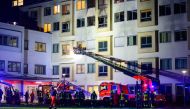 Firefighters work on early January 5, 2024 during a fire that broke out at a hospital in the northern German town of Uelzen. Photo by Philipp Schulze / dpa / AFP