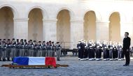 French President Emmanuel Macron (R) stands in front of the coffin of late French minister and European Union Commission president Jacques Delors during a national ceremony at the Hotel des Invalides in Paris, on January 5, 2024. Photo by STEPHANIE LECOCQ / POOL / AFP
