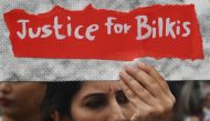 (Files) A woman holds a placard during a protest against the release of 11 men convicted in Bilkis Bano case in Mumbai on August 23, 2022. (Photo by Indranil Mukherjee / AFP)