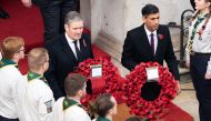 Britain's main opposition Labour Party leader Keir Starmer (left) and Britain's Prime Minister Rishi Sunak come out to lay wreaths at The Cenotaph during the Remembrance Sunday ceremony on Whitehall in central London, on November 13, 2022. (Photo by Stefan Rousseau / POOL / AFP)
